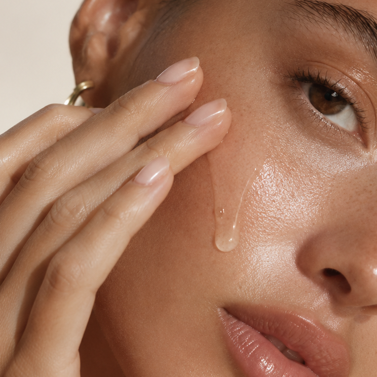 Close-up of hydrated skin with ampoule applied to the face