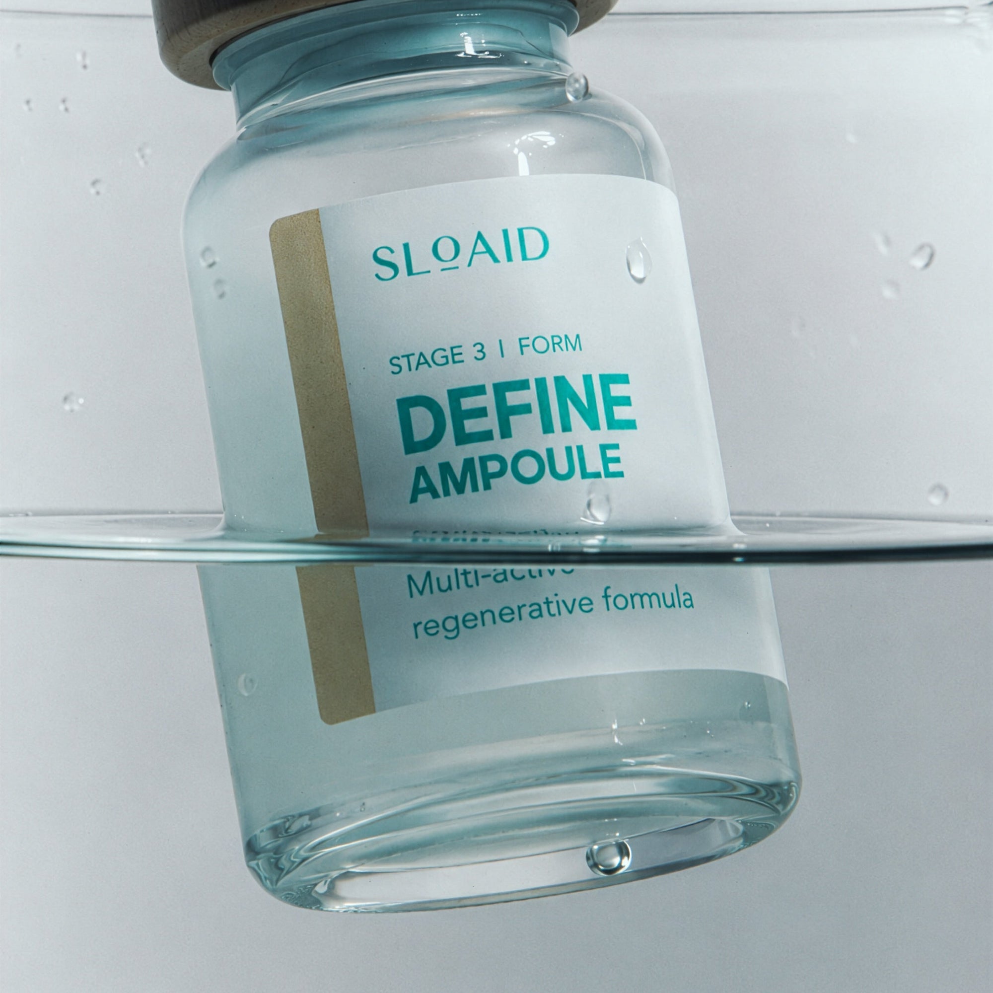 SLOAID Define Ampoule immersed in water, representing hydration and active delivery